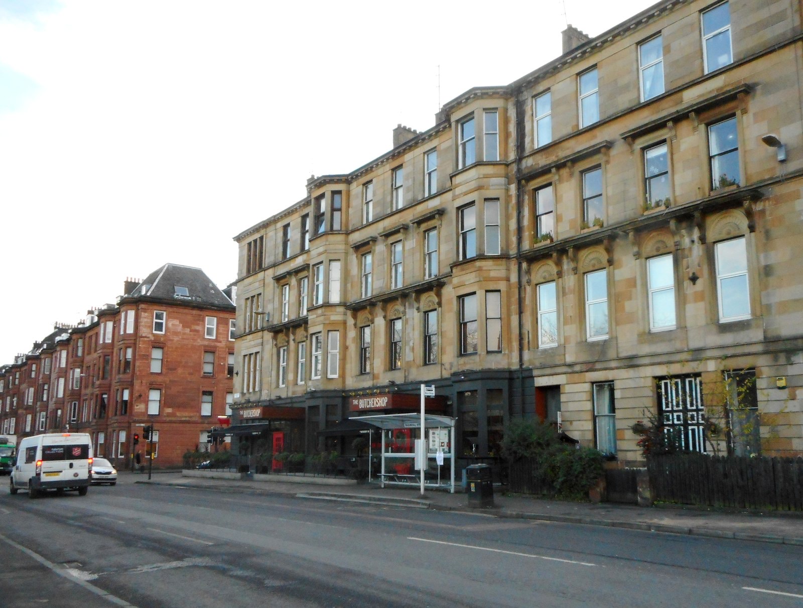 Warm sandstone tenement flats on a Glasgow street